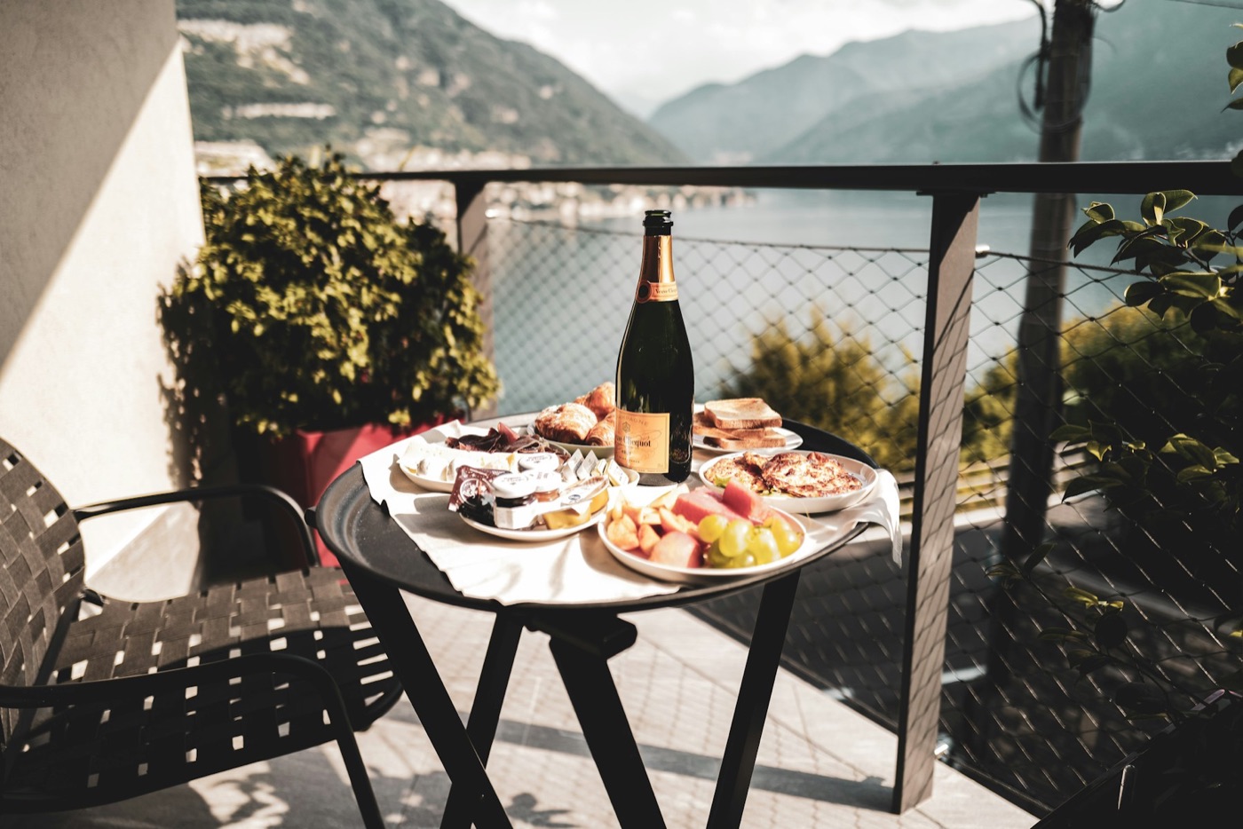 Breakfast beside a lake with mountains beyond